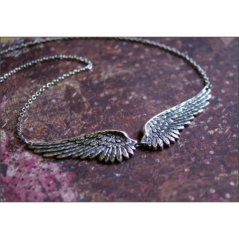 Necklace with angel wings and feathers