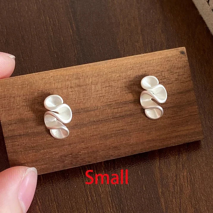 Twisted flower earring in sterling silver and gold