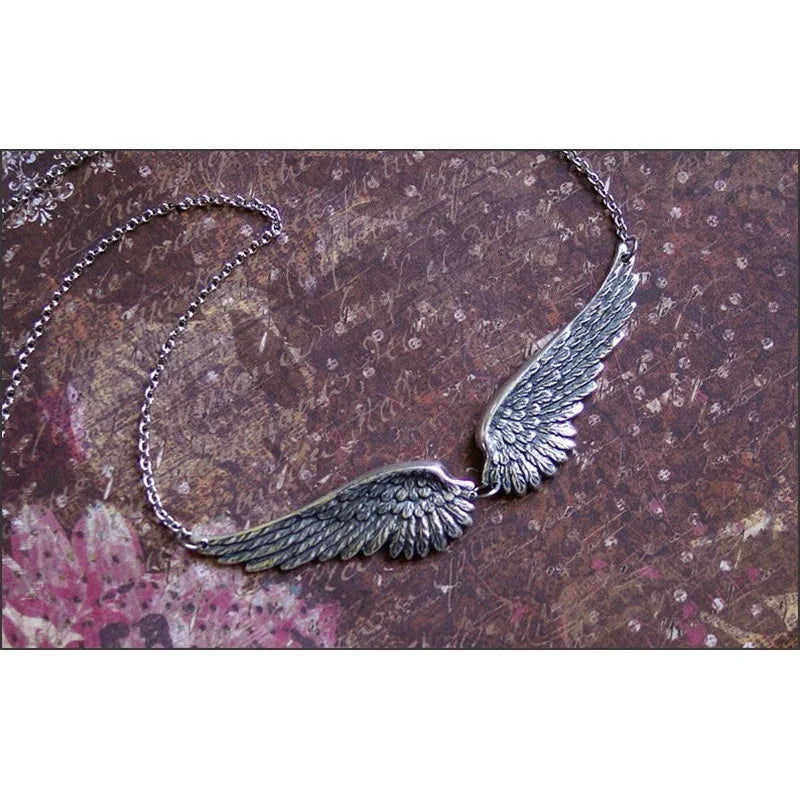 Necklace with angel wings and feathers