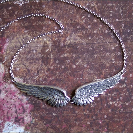 Necklace with angel wings and feathers